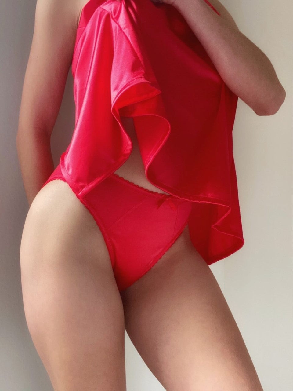 Red satin panties with ruffled panels and scalloped lace trim