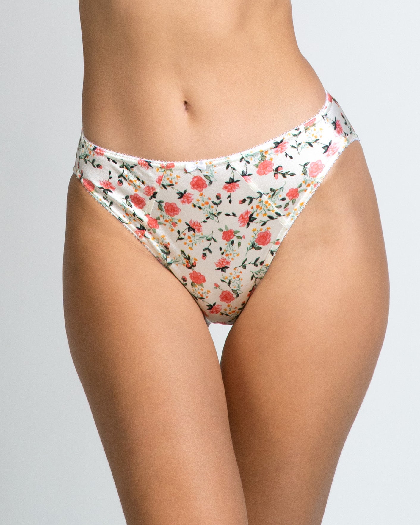 Floral rose panties in white with red and green prints, close-up high-cut back
