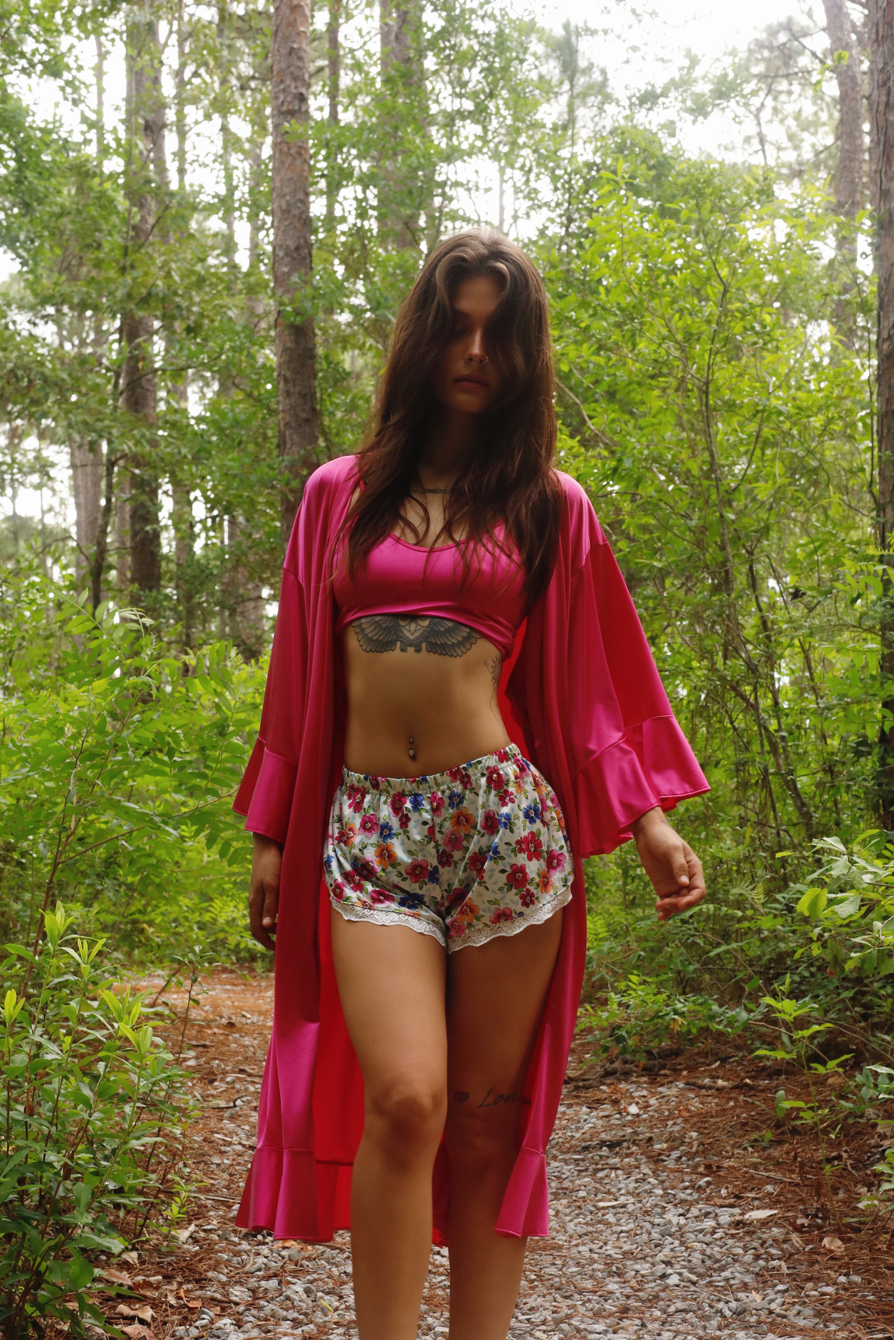 Long fuchsia satin robe with loose fit, bell sleeves, and tie belt