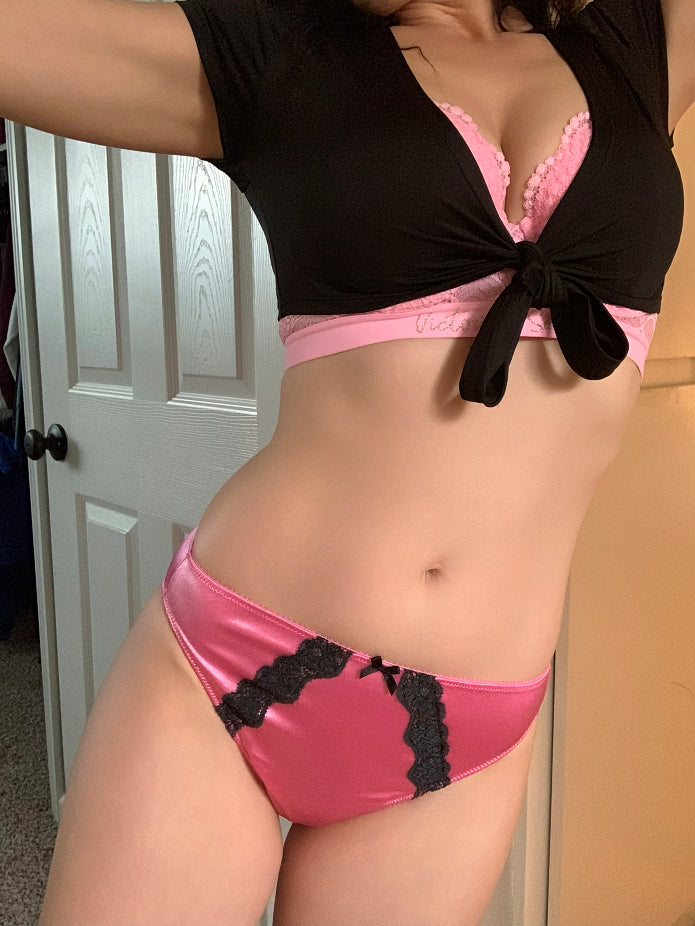 Pink satin bikini panty with black lace side panels and bow at the waistband