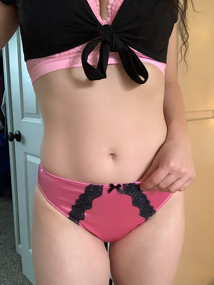 Bubblegum pink panty with black lace front panel and center bow on waistband