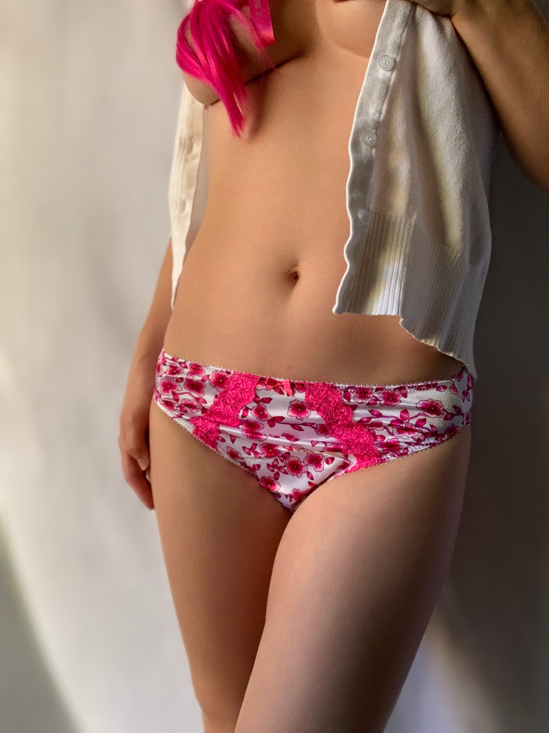 Hot pink floral lace-trim brief with scalloped edges and ruched lace panel at center