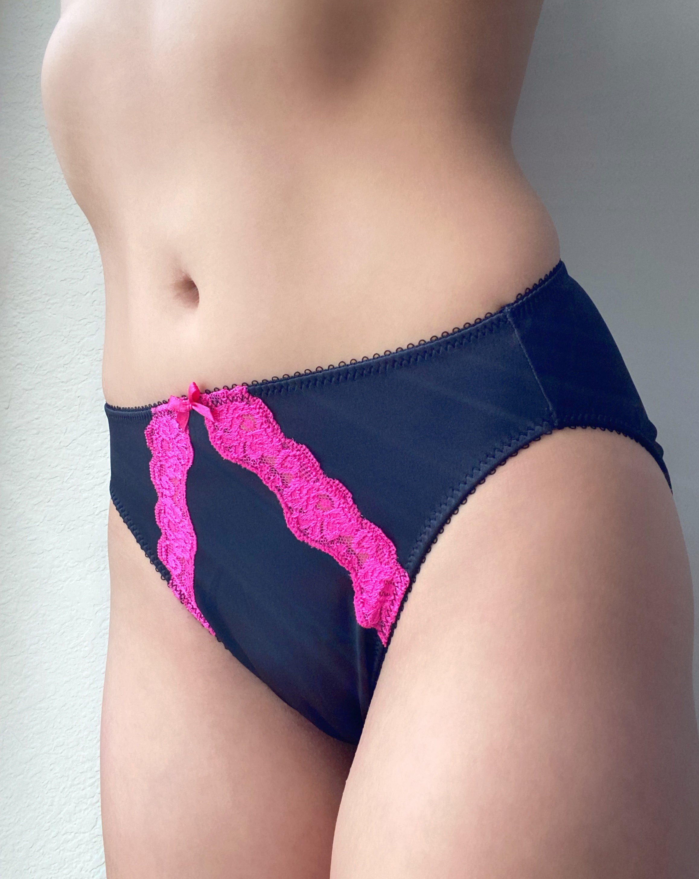 Dark panties with bright pink lace appliqué and scalloped trim