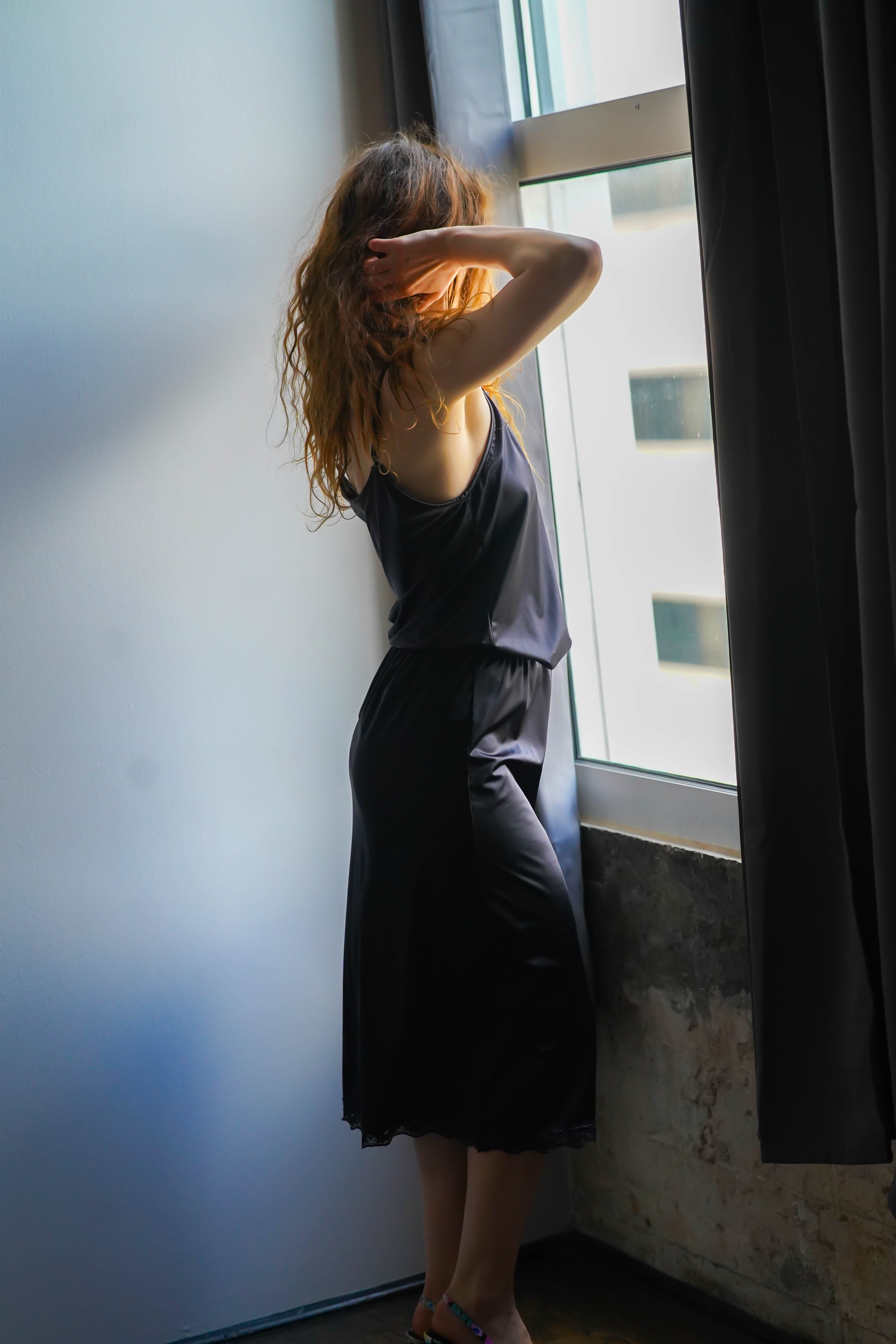 Katie half slip, midnight black satin skirt with elastic waist and lace hem trim.