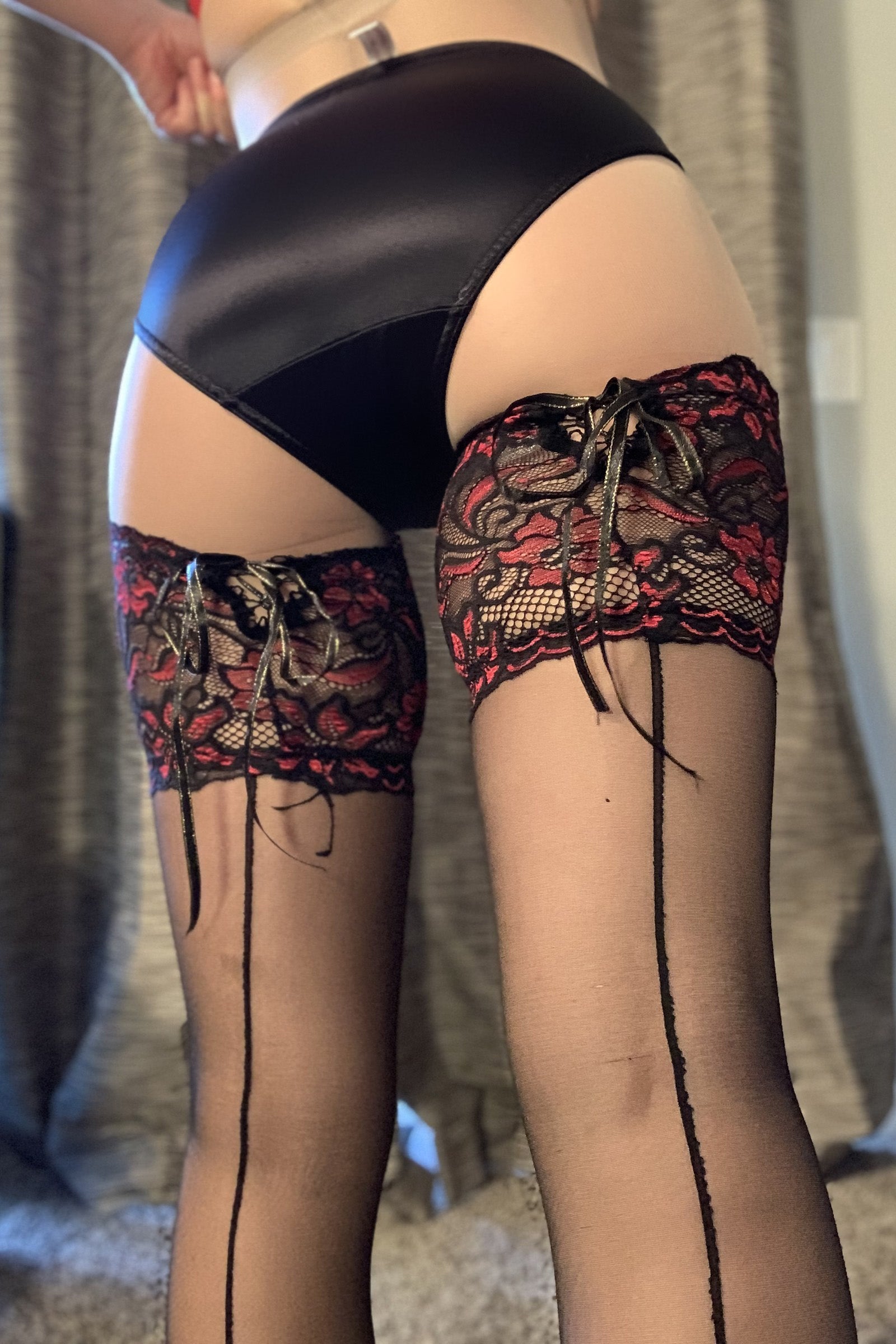 Midnight black hipster panty with lace garter cuffs and floral embroidered tops