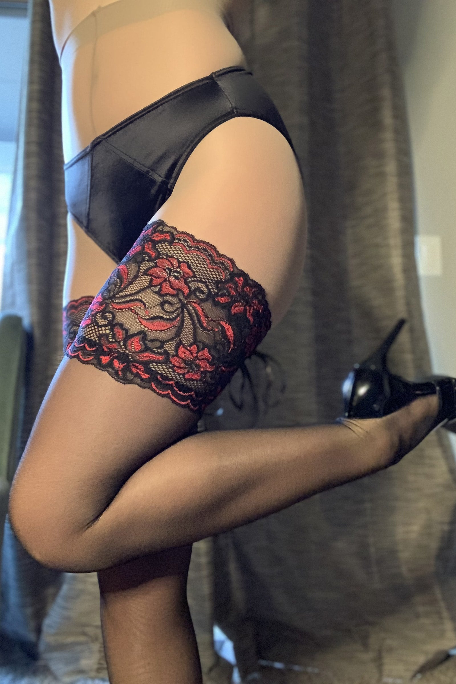 Midnight black hipster panty with lace garter cuffs and floral embroidery
