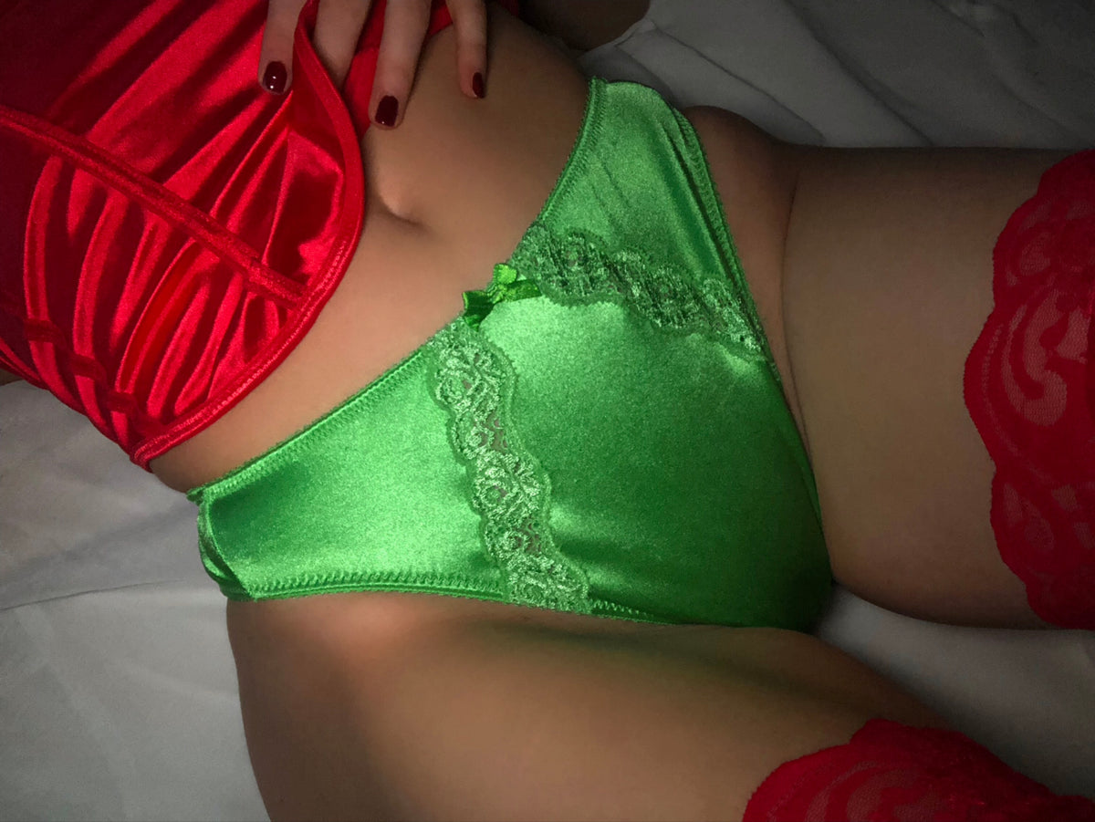 Lucky green satin panty with lace trim and triangle cut, close-up front view